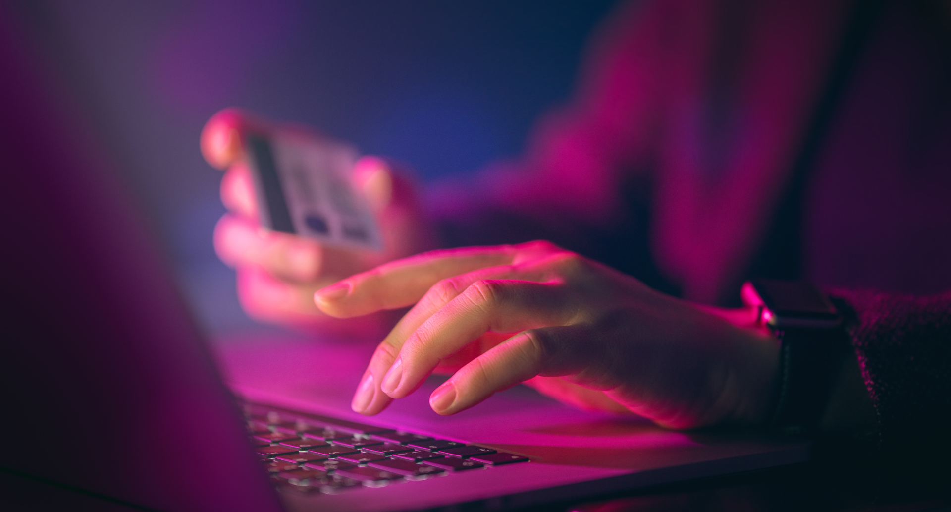 Online transaction with credit card on laptop.